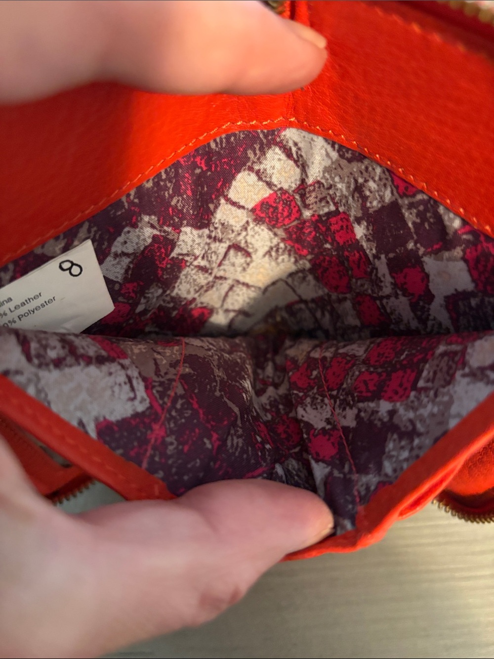 orange leather Elliott Lucca wristlet features a hand-painted peacock feather - Picture 6 of 8